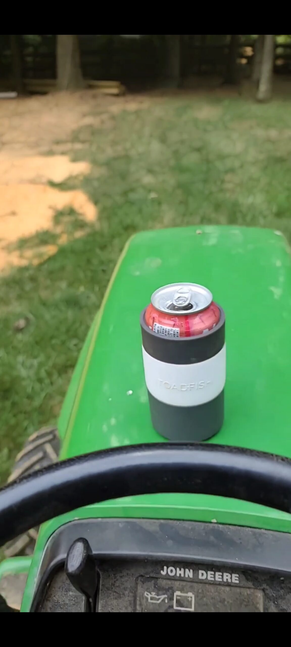 koozie on a lawnmower