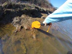 Pushing off a Rock with Kayak Paddle