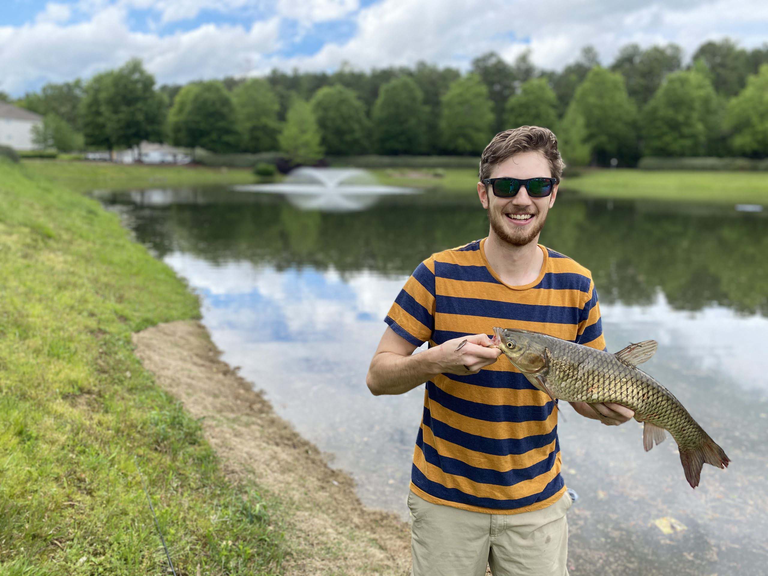 Holding A Grass Carp